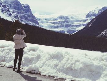 People standing on snow covered mountain