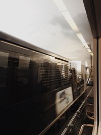 Train at railroad station against sky