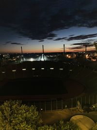 High angle view of illuminated buildings against sky at sunset