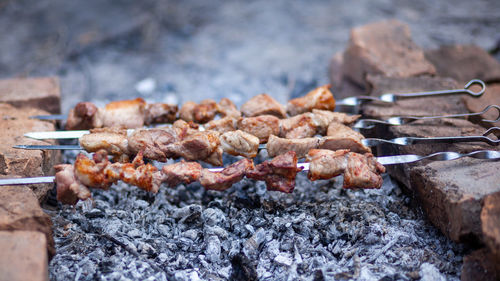 Close-up of meat on barbecue grill