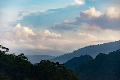 Scenic view of mountains against sky at sunset