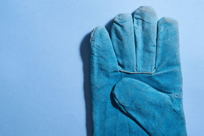 High angle view of towels against blue background