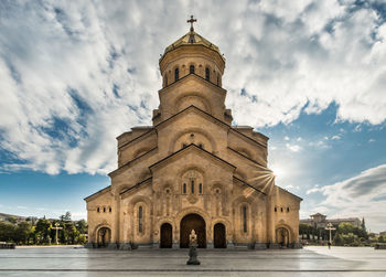 Low angle view of cathedral against cloudy sky