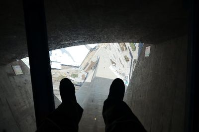 Low section of people on tiled floor