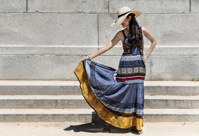 Full length of woman wearing hat