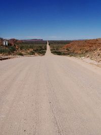 Road amidst landscape against clear sky