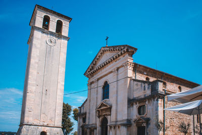 Low angle view of building against blue sky