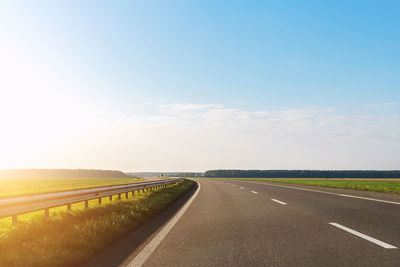 Empty road against clear sky