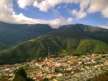 High angle view of town against cloudy sky