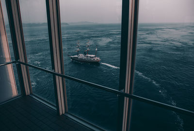 High angle view of boat sailing on sea against sky