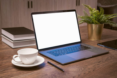 Close-up of laptop on table