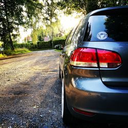 Close-up of car on road