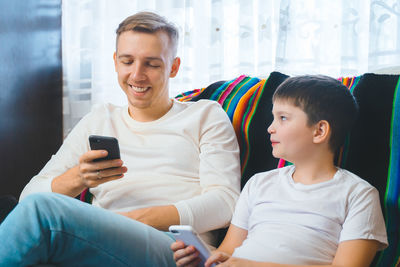 Friends sitting on mobile phone