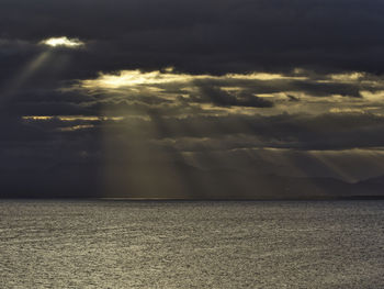 Scenic view of dramatic sky over sea during sunset