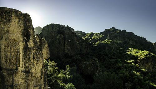 Low angle view of rock formation against clear sky