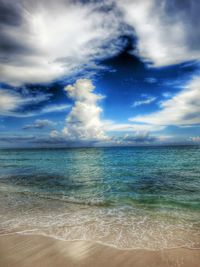 Scenic view of sea against cloudy sky