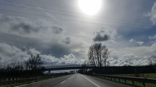 View of road against cloudy sky