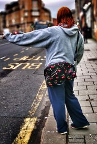 Rear view of man standing on street