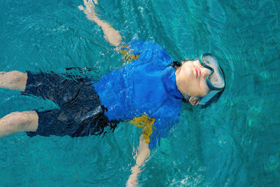 High angle view of man swimming in sea