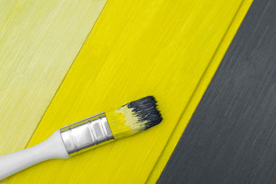 High angle view of paintbrushes on table