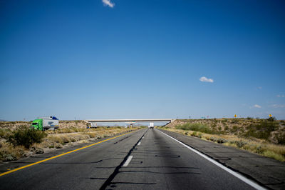 Empty road along landscape