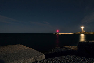 Scenic view of sea against sky at night