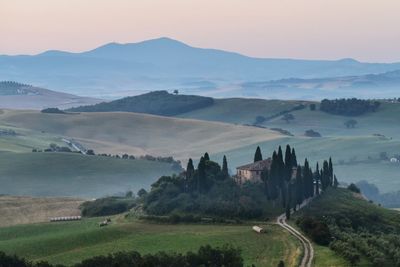 Scenic view of landscape and mountains against sky