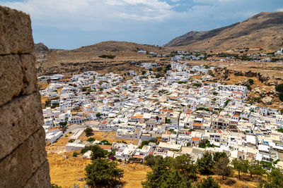 View at the city of lindos on greek island rhodes with white houses and mountain