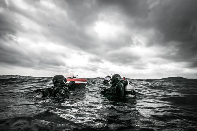 Man on sea against sky