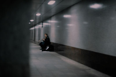 Full length of man walking in illuminated building