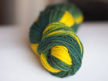 Close-up of multi colored wool skein on table