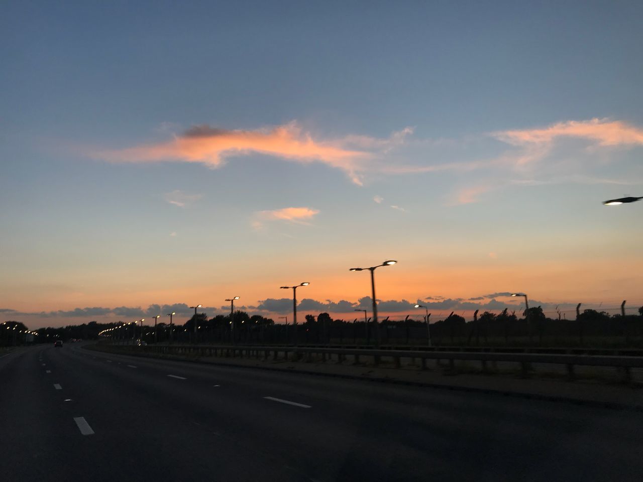 sky, sunset, road, transportation, cloud - sky, nature, orange color, street, no people, mode of transportation, car, motor vehicle, beauty in nature, the way forward, land vehicle, outdoors, direction, city, highway, scenics - nature