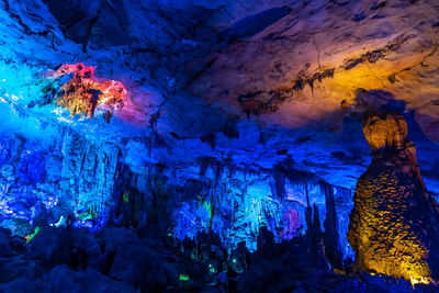 Low angle view of illuminated cave