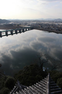 High angle view of bridge over river against cloudy sky