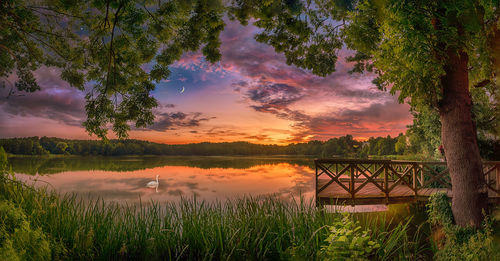 Scenic view of lake against sky during sunset