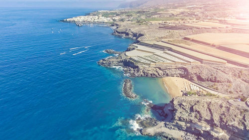 High angle view of sea against blue sky