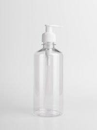 Close-up of glass bottle against white background