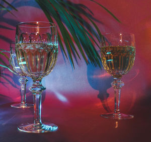 Close-up of wine glasses on table