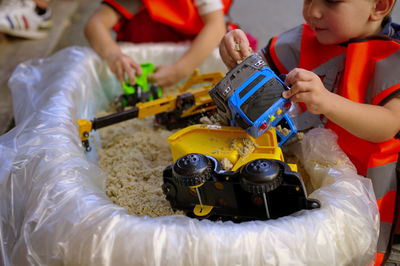 Cute little toddlers playing in sand