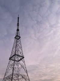 Low angle view of communications tower against sky