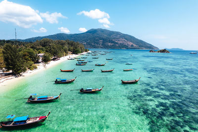 High angle view of boats in sea against sky