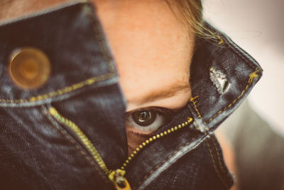 Close-up portrait of serious woman in jeans pant