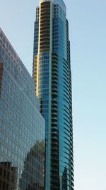 Low angle view of modern buildings against clear sky