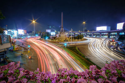 High angle view of light trails in city at night