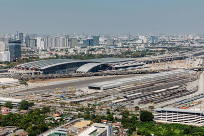 High angle view of city street and buildings against sky