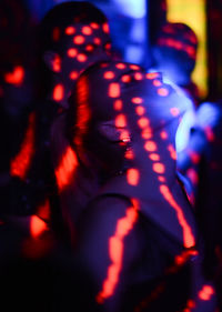 Rear view of people at night