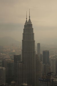 Modern buildings in city against sky