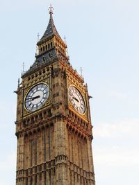 Low angle view of clock tower against sky