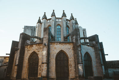 Low angle view of historic building against clear sky