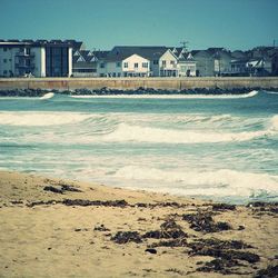 View of beach against blue sky